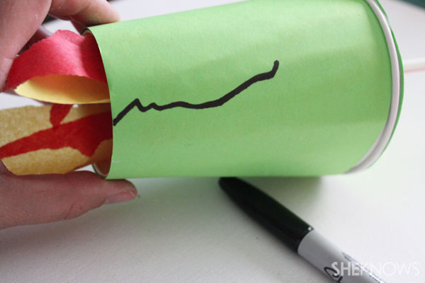 DIY Fire-breathing dragon craft: Draw on mouth