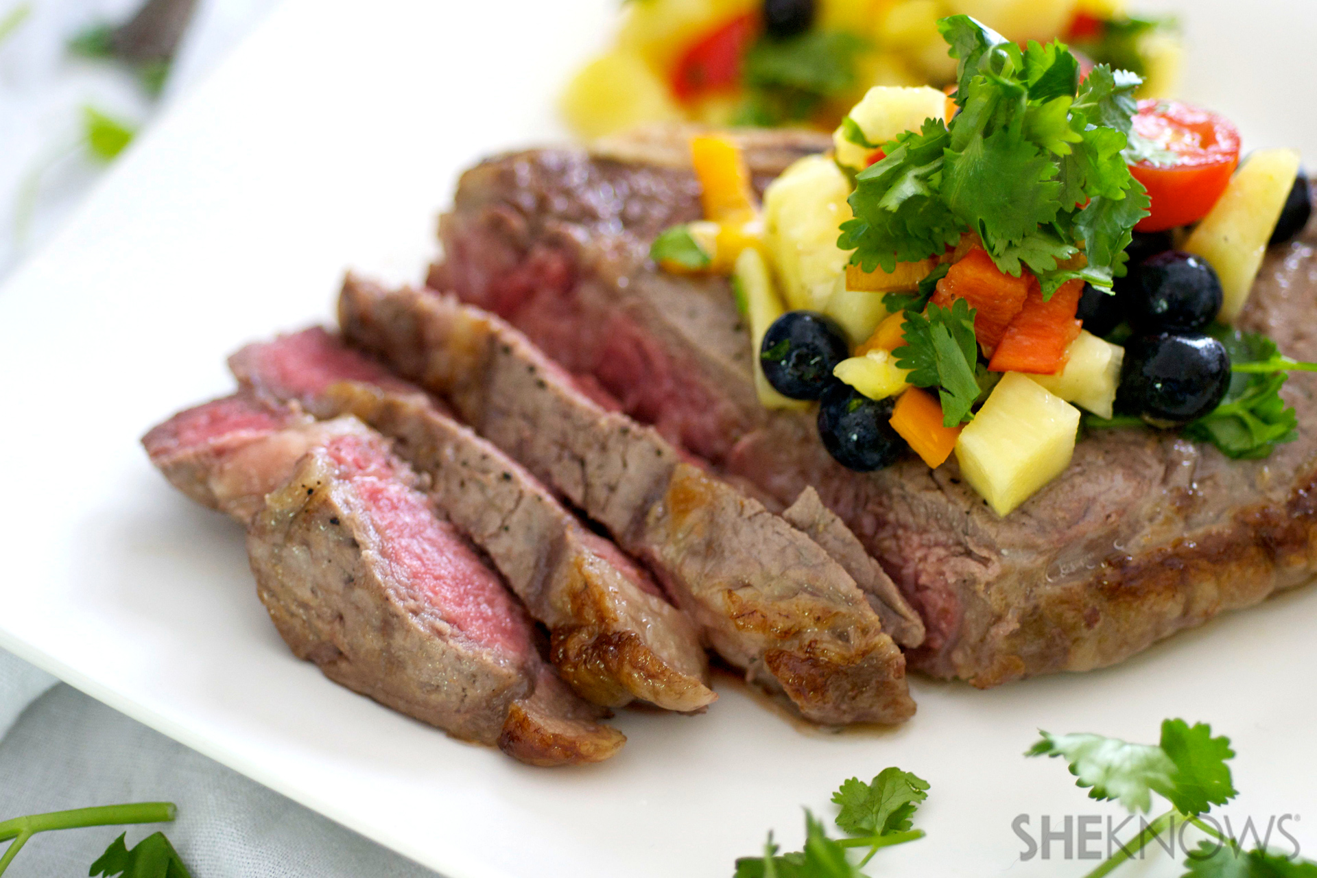 Sizzling steak with pineapple rum salsa