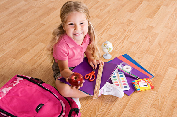 Girl withSchool supplies (sheknows.com)